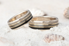 custom made wedding rings made from white and yellow gold, LP  vinyl record, guitar string and beach sand