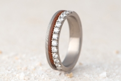 engagement ring made from titanium, damascus steel, desert ironwood wood and diamands