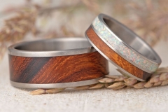 titanium wedding ring with desert ironwood and white opal inlay